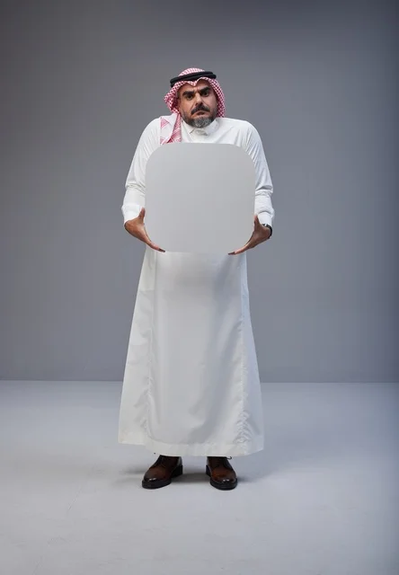 Saudi Man Holding Blank White Board in Studio