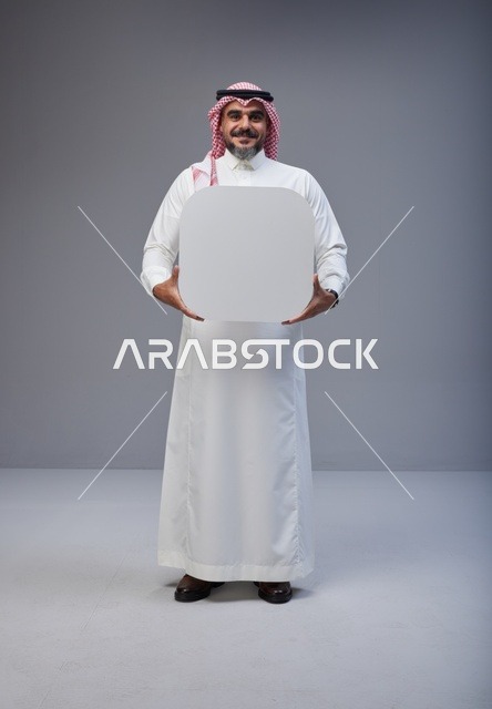 Saudi Man Holding Blank White Board in Studio