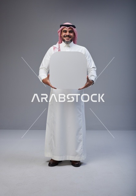 Saudi Man Holding Blank White Board in Studio
