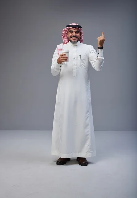 Saudi Man in Thobe Holding Coffee Pointing Upward
