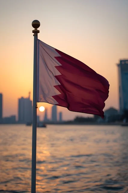 Qatar National Flag in Doha at Sunset