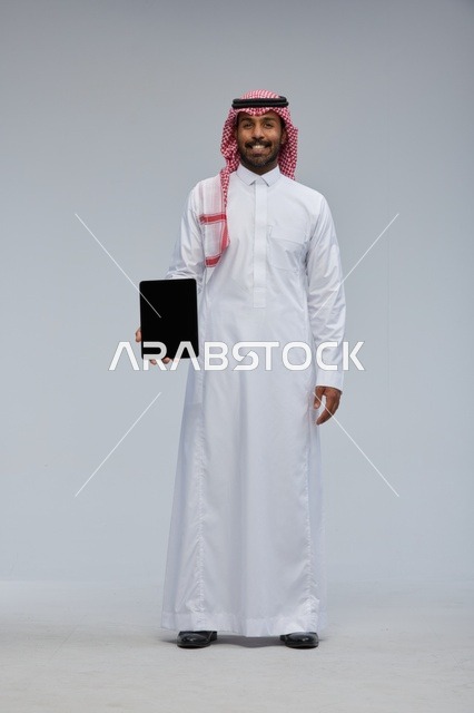 Saudi Man Holding Digital Tablet with Blank Screen