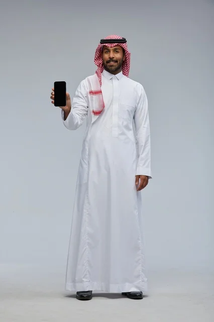 Saudi Man Holding Blank Smartphone Screen in Studio