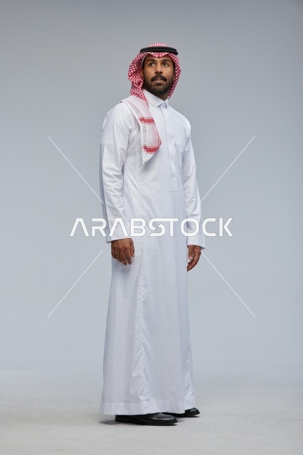 Saudi Man in Traditional Thobe Standing in Studio