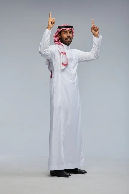Saudi Man in Traditional Thobe Pointing Upwards