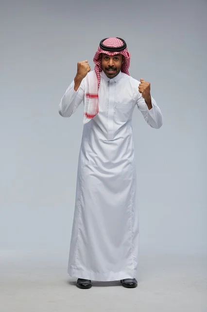 Saudi Man in Traditional Thobe Success Pose