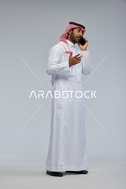 Saudi Man Talking on Smartphone in Studio