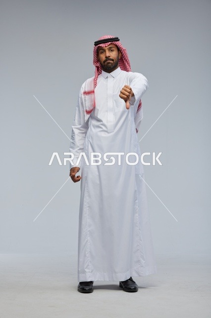 Saudi Man in Traditional Thobe Giving Thumbs Down