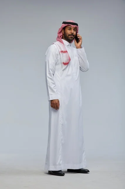 Saudi Man Talking on Smartphone in Studio Shot