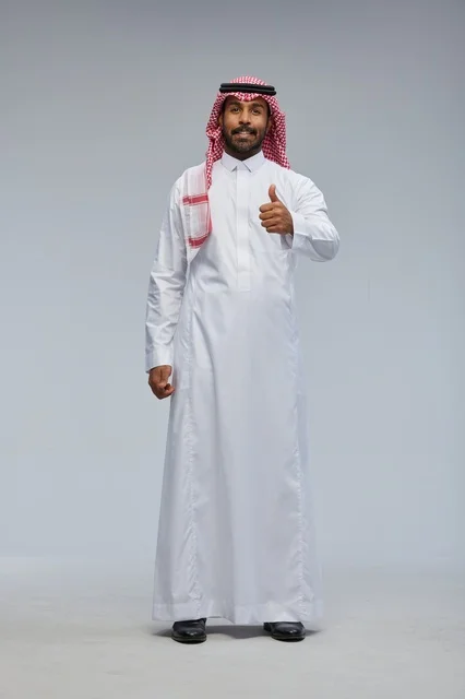 Saudi Man in Traditional Thobe Giving Thumbs Up