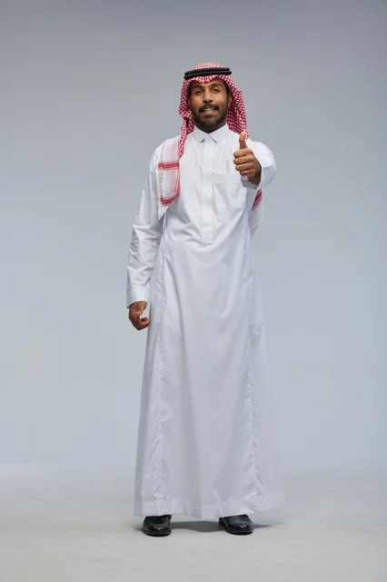 Saudi Man in Traditional Thobe Giving Thumbs Up