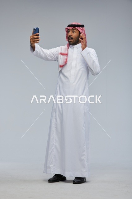 Saudi Man Taking Surprised Selfie on Smartphone