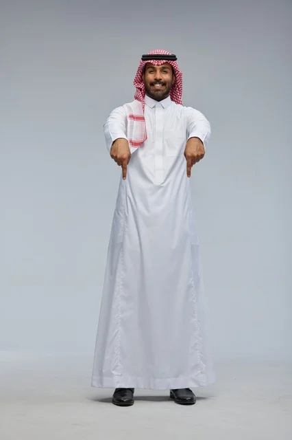 Saudi Man in Traditional Thobe Pointing Downward