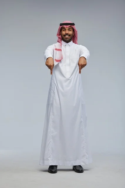 Saudi Man in Traditional Thobe Pointing Down