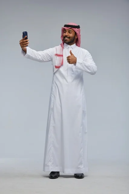 Saudi Man Taking Selfie with Smartphone Thumbs Up
