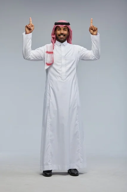 Saudi Man in Traditional Dress Pointing Upwards