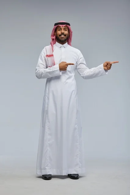 Saudi Man in Traditional Thobe Pointing Side View