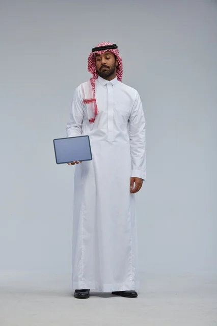 Saudi Man Holding Digital Tablet in Studio