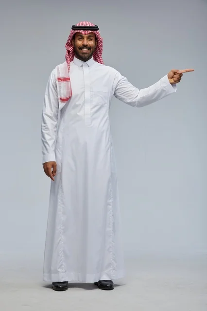Saudi Man Pointing Side in Traditional Thobe