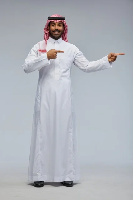 Saudi Man in Traditional Thobe Pointing Aside
