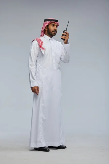 Saudi Man in Thobe Using Walkie-Talkie Studio