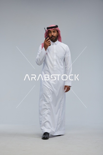 Saudi man using walkie-talkie for communication