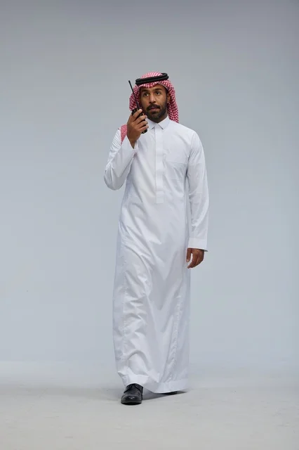 Saudi man using walkie-talkie for communication