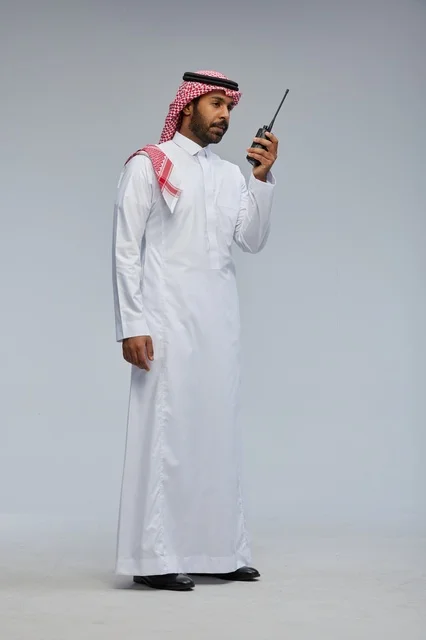 Saudi man using walkie-talkie for communication