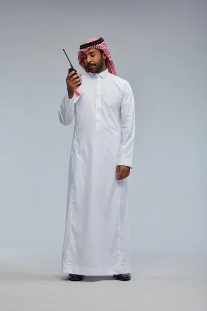 Saudi man using walkie-talkie for communication