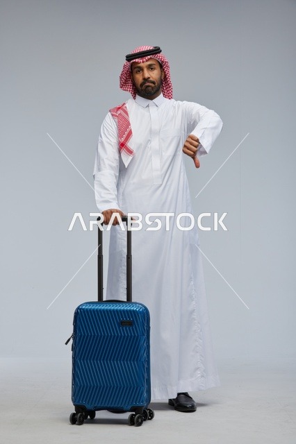 Saudi Man with Suitcase Disappointed Thumbs Down Studio