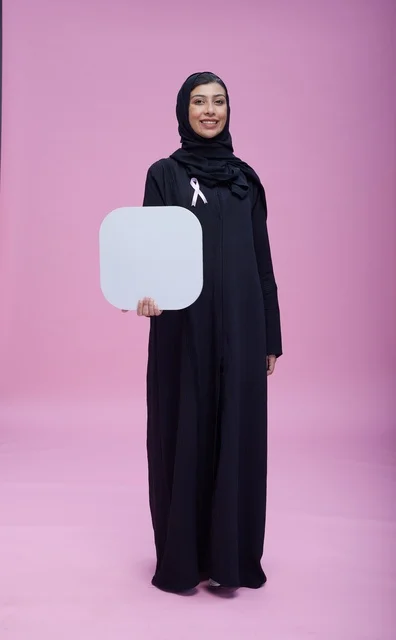 Saudi Woman Holding Blank Board on Pink Background