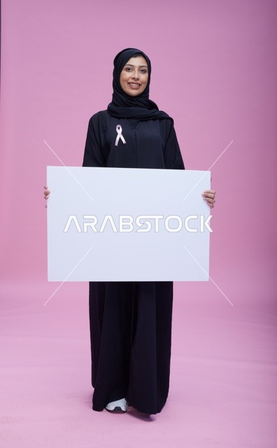Saudi Woman with Blank Sign for Breast Cancer Awareness