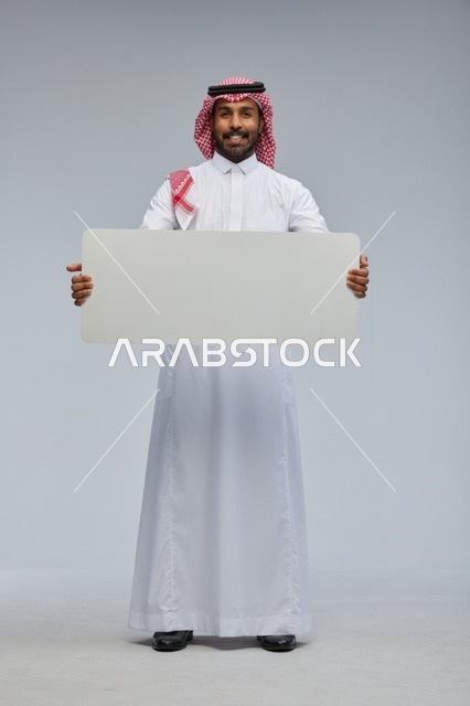 Saudi Man in Traditional Thobe Holding Blank White Board