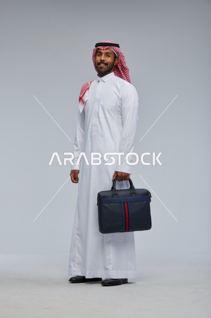 Saudi Businessman with Briefcase in Studio Portrait
