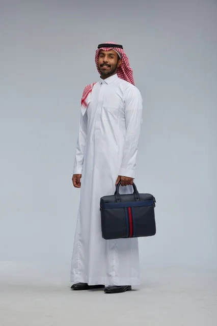 Saudi Businessman with Briefcase in Studio Portrait