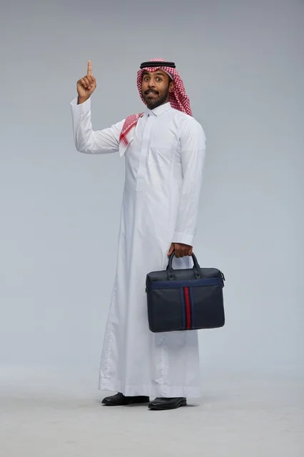 Saudi Businessman in Thobe Pointing Up with Briefcase