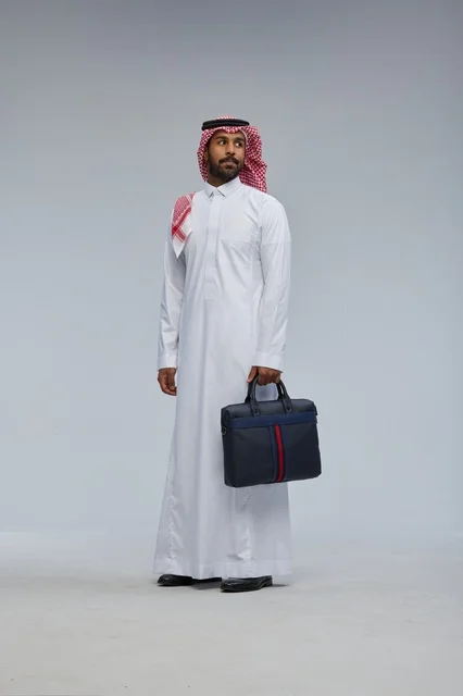 Saudi Businessman with Briefcase in Studio Portrait