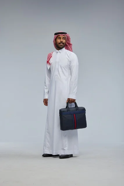Saudi Businessman with Briefcase in Studio Background