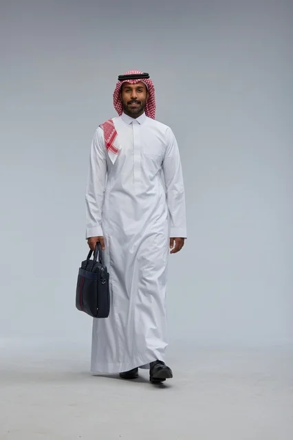 Saudi Businessman Walking with Briefcase in Studio