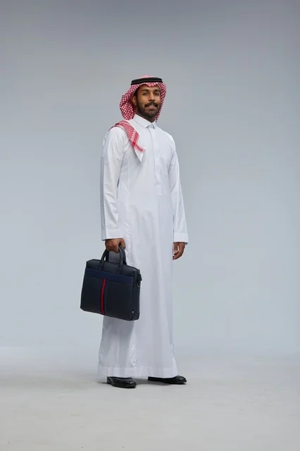 Saudi Businessman with Briefcase in Studio Portrait