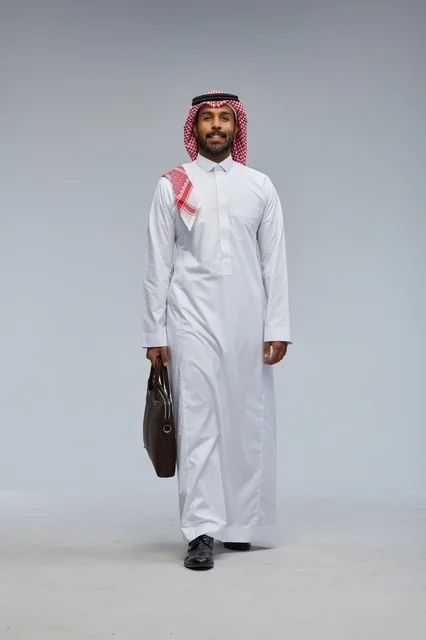 Saudi Businessman Walking with Briefcase in Studio