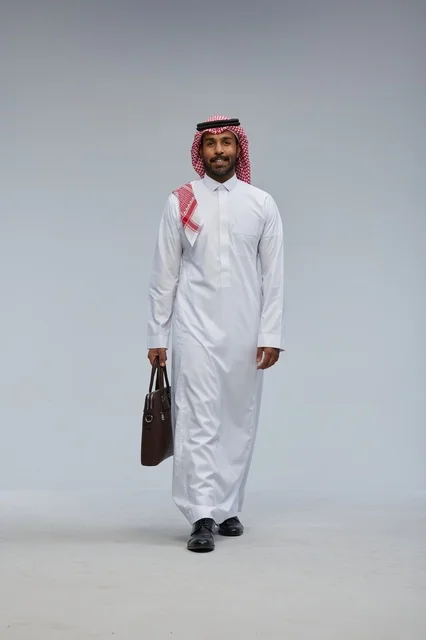 Saudi Businessman Walking with Briefcase in Studio