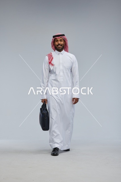 Saudi Businessman Walking with Briefcase in Studio