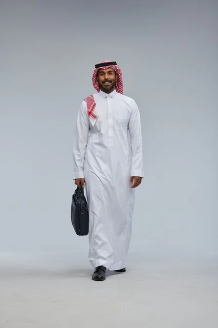 Saudi Businessman Walking with Briefcase in Studio