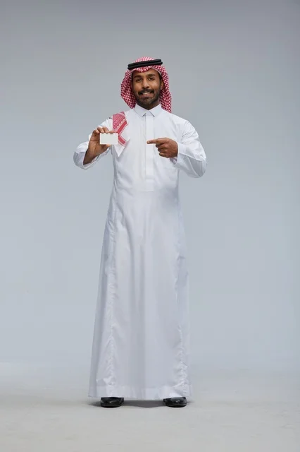 Saudi Man Holding Blank White Card in Studio Full Body