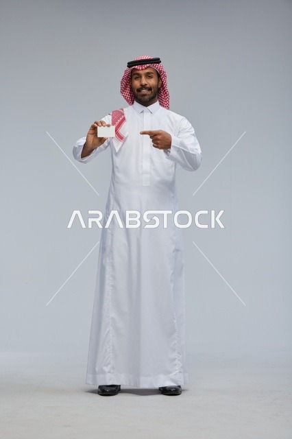 Saudi Man Holding Blank White Card in Studio