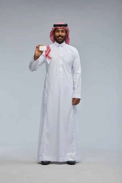 Saudi Man Holding Blank Card in Studio Full Body