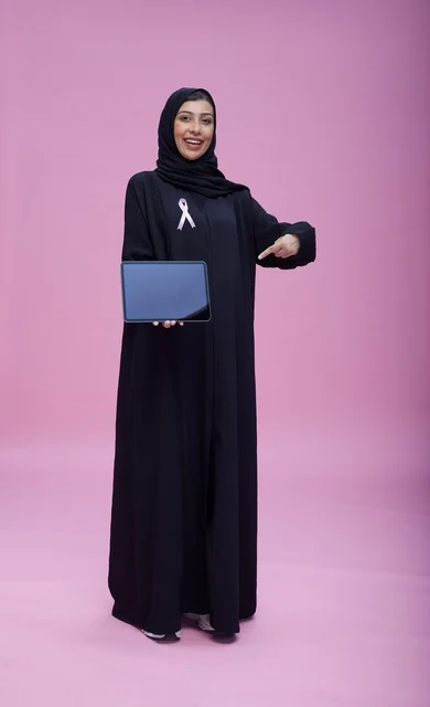 Saudi Woman Holding Tablet for Health Awareness
