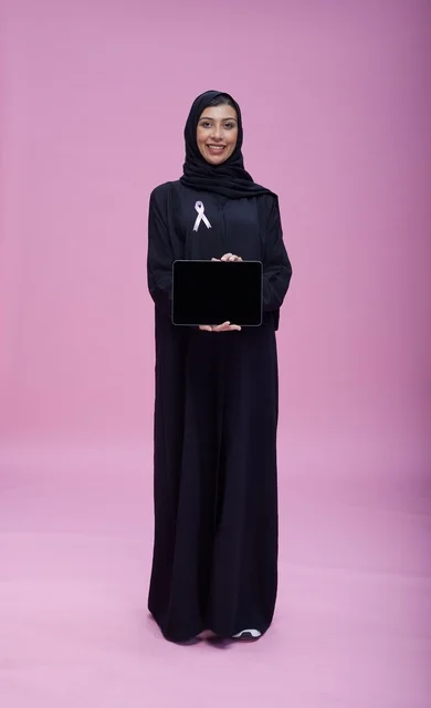 Saudi Woman with Tablet for Breast Cancer Awareness