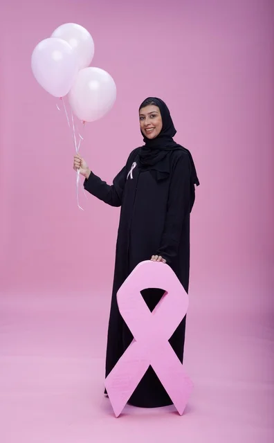 Saudi Woman with Pink Ribbon for Breast Cancer Awareness